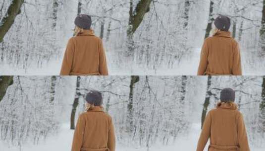女人走过冬天的森林高清在线视频素材下载