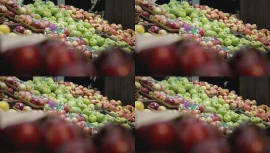 在水果市场选择成熟的红苹果高清在线视频素材下载