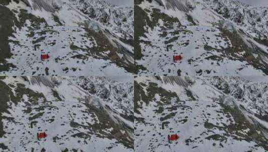 航拍攀登川西勒多曼因雪山登山者帐篷营地高清在线视频素材下载