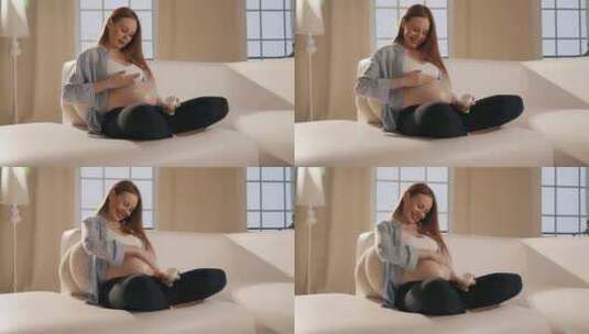 孕妇腹部涂抹乳膏女性在怀孕期间用乳膏按摩高清在线视频素材下载