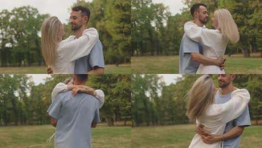 快乐的夫妇在公园里旋转享受家庭生活高清在线视频素材下载