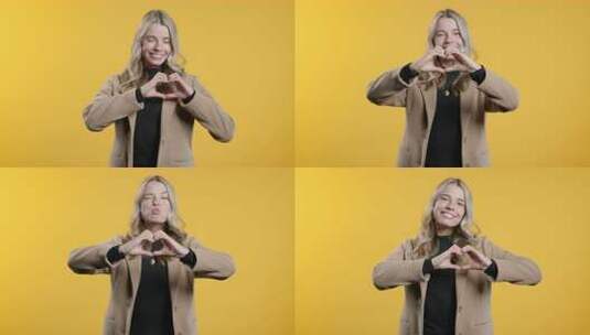 微笑的女商人展示形状心脏的标志积极的企业高清在线视频素材下载