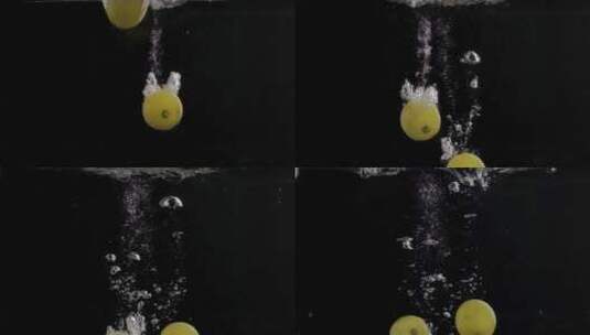 柠檬慢动作落水黑背景高清在线视频素材下载