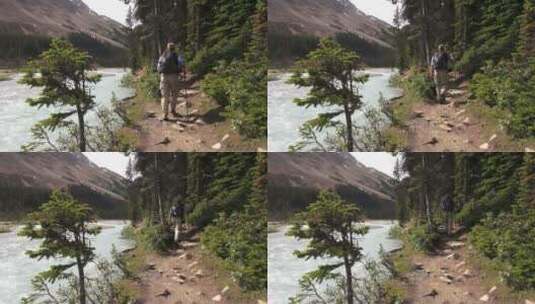 男子沿着溪流徒步旅行高清在线视频素材下载