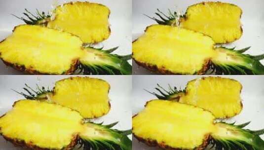 在水龙头下把菠萝切成两半高清在线视频素材下载