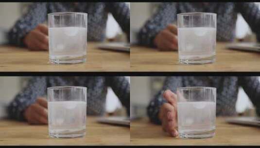 桌子上水杯里的泡腾片高清在线视频素材下载