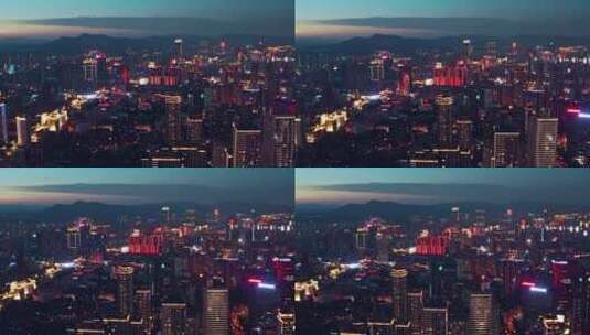 汇都国际楼顶航拍华灯初上时的昆明城市风光高清在线视频素材下载