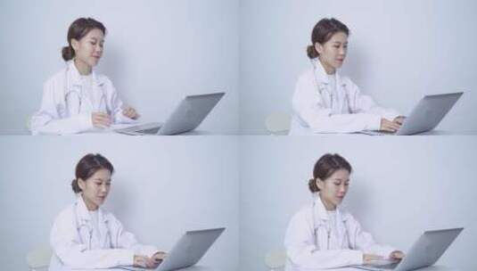 女医生使用笔记本电脑工作高清在线视频素材下载