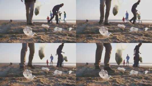 年轻人在海滩上捡塑料瓶的特写高清在线视频素材下载