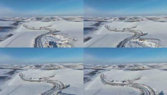 冬季丘陵山区蜿蜒穿行在雪野中的道路高清在线视频素材下载