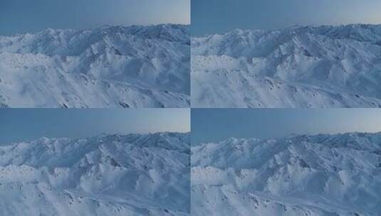 航拍阳光下的雪山黎明前巍峨山峰山脉山峦高清在线视频素材下载