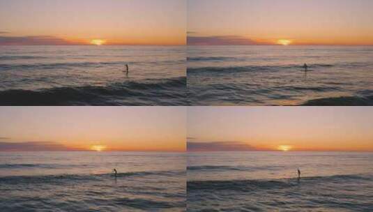 日落时划着冲浪板的人高清在线视频素材下载