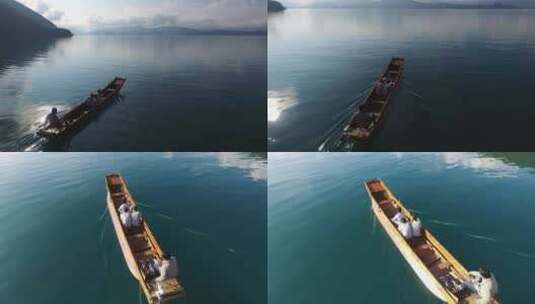 云南泸沽湖水上船游客近景航拍高清在线视频素材下载