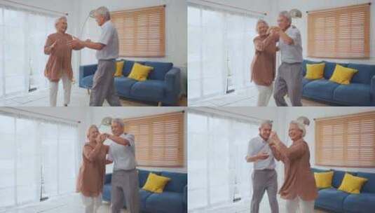 亚洲活跃的老年夫妇在家里的客厅里一起跳舞高清在线视频素材下载