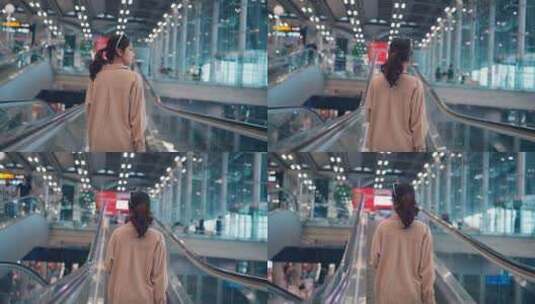 亚洲女游客带着简单的手提箱站在机场候机楼高清在线视频素材下载