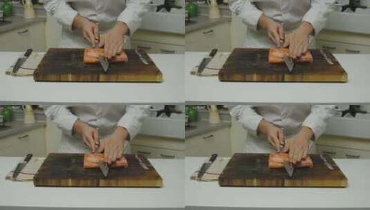 明星厨师在木板上将新鲜鲑鱼片切成薄片，特高清在线视频素材下载