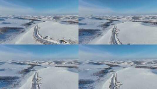 冬季丘陵山区蜿蜒穿行在雪野中的道路高清在线视频素材下载