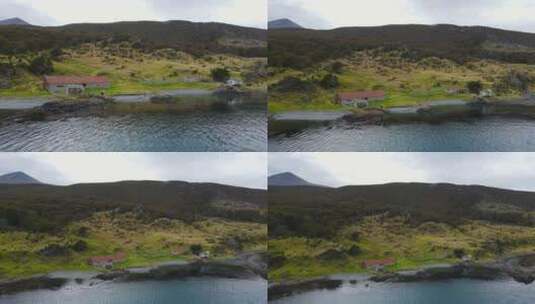 乌斯怀亚巴塔哥尼亚阿根廷海岸岩石海岸的无人机视频，有一个红色的谷仓和家高清在线视频素材下载