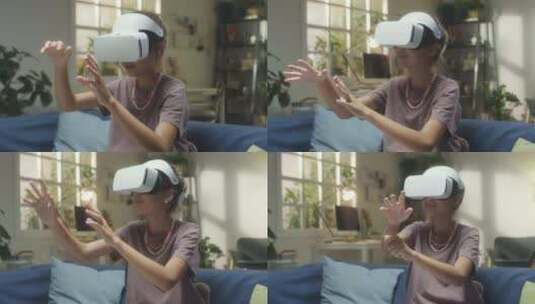 VR耳机中的女孩在家玩高清在线视频素材下载