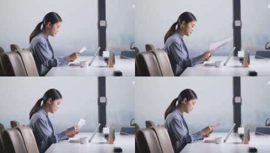 职场女性在办公室查阅文件高清在线视频素材下载