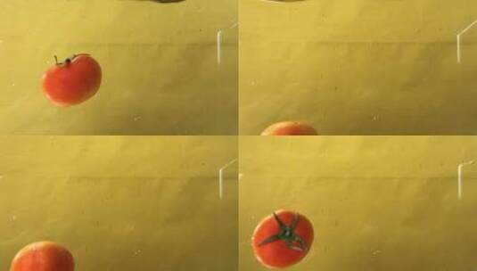 IMG_0747番茄强入水一瞬间黄背景B高清在线视频素材下载