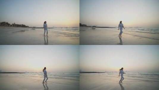 女人在海滩上自由奔跑高清在线视频素材下载