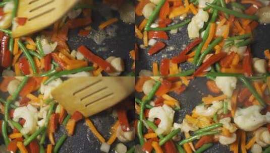 热气腾腾的蔬菜在平底锅上油炸的特写镜头高清在线视频素材下载