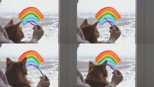 抱着宠物在窗户上画彩虹高清在线视频素材下载