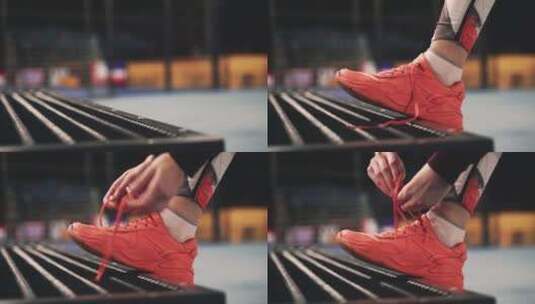 运动员在长凳上系鞋带的特写镜头高清在线视频素材下载