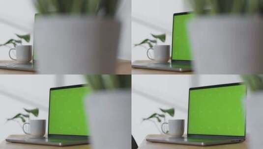 桌子上的绿屏电脑高清在线视频素材下载