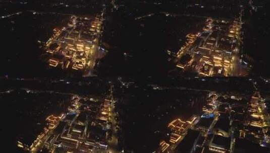 俯瞰仿古建筑商业街步行街夜景亮化前飞下降高清在线视频素材下载