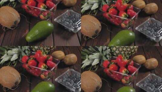 木制背景下新鲜水果的特写鳄梨草莓菠萝高清在线视频素材下载