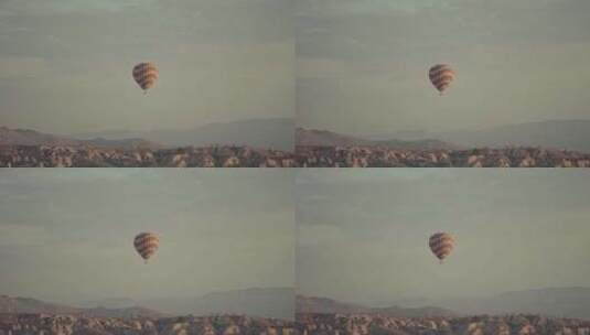 在山上飞行的热气球高清在线视频素材下载