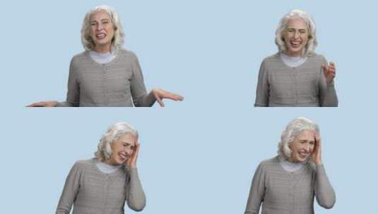 高龄妇女在蓝色背景前大笑高清在线视频素材下载