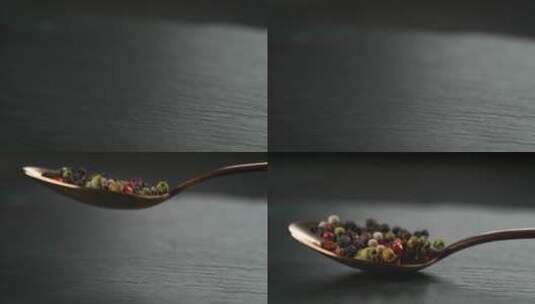 黑胡椒洒落在勺子上特写高清在线视频素材下载