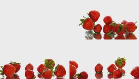 草莓落在白色背景的表面上高清在线视频素材下载