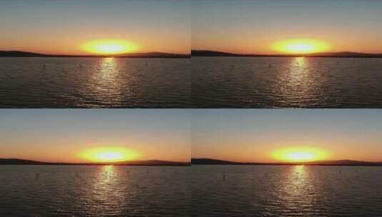 航拍夕阳日落湖面倒影高清在线视频素材下载