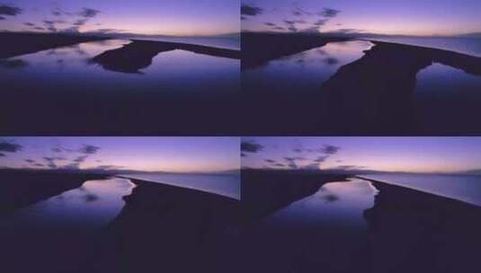 低空航拍青海湖夕阳晚霞倒映水面唯美风景高清在线视频素材下载