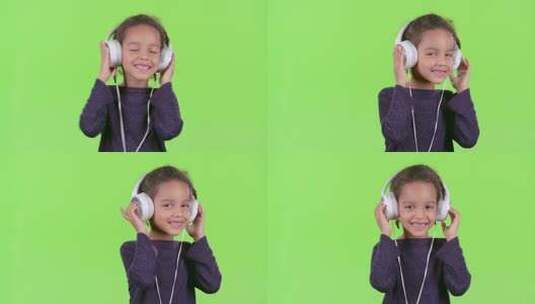 孩子听耳机里的音乐高清在线视频素材下载