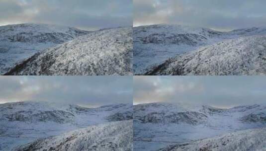 航拍高山雪景大雪覆盖山峰云雾雪景高清在线视频素材下载