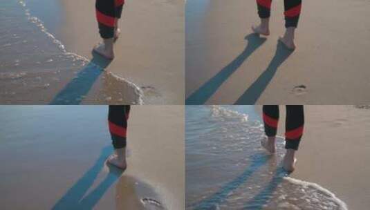 沙滩上的赤脚行走的人高清在线视频素材下载
