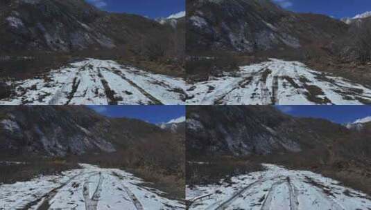 四川甘孜贡嘎山乡上城子村雪地上留下的车辙高清在线视频素材下载