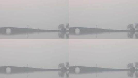 杭州西湖白堤初冬晨雾雾霾空镜高清在线视频素材下载