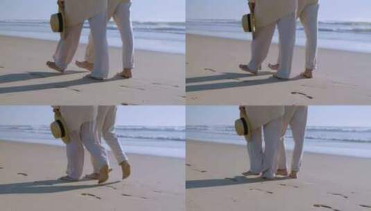一对夫妇在海滩散步高清在线视频素材下载