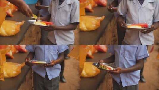 非洲农村小学生从学校供餐计划中获得新鲜水高清在线视频素材下载