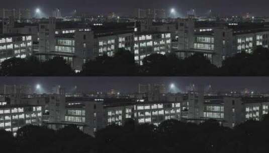 航拍上海东华大学松江校区建筑夜景高清在线视频素材下载