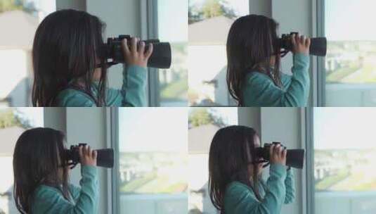 小女孩拿望远镜看向窗外高清在线视频素材下载