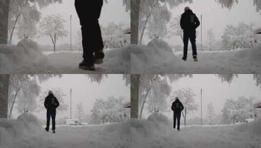 男子在雪地上行走高清在线视频素材下载