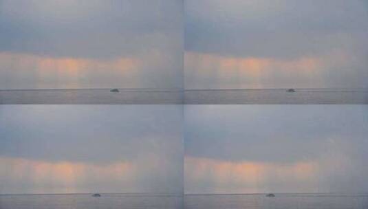 海南三亚海岛早晨海上日出丁达尔风光高清在线视频素材下载