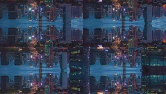 夜晚摩天大楼的镜子效果高清在线视频素材下载